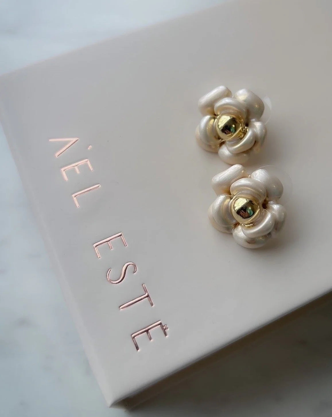 gold and silver flower stud earrings with box ael este