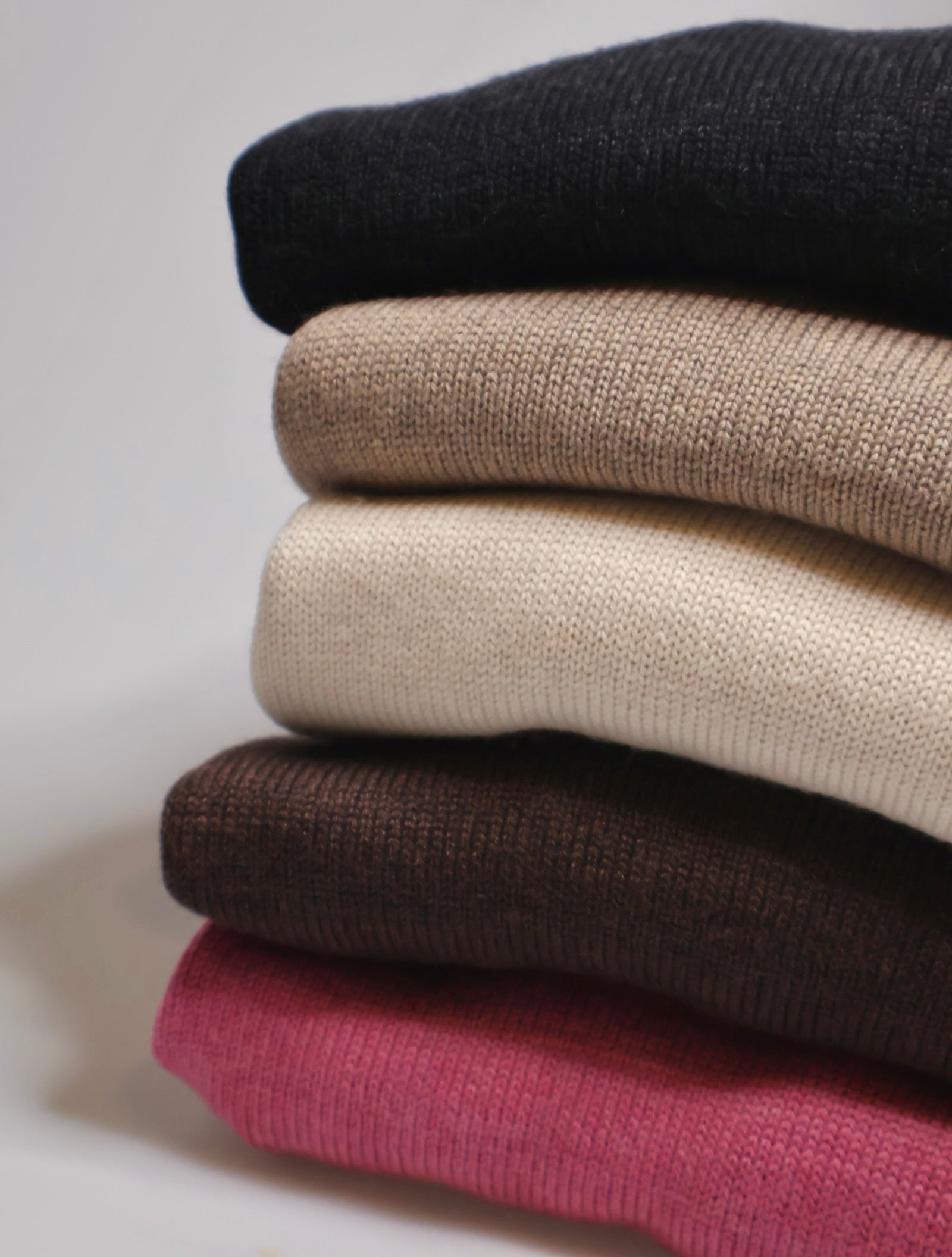 Uimi merino wool knitwear folded stack, Australian made